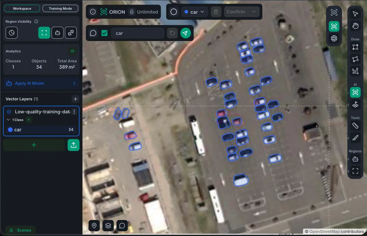 Cars detected in a parking lot at a resolution where the broad class is identifiable but finer distinctions like cars vs vans would not be reliable
